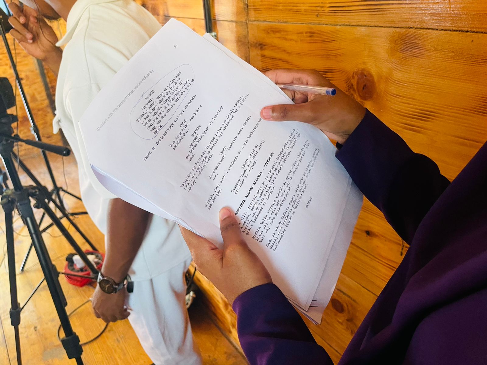 A participant reviewing a Somali-language shooting script