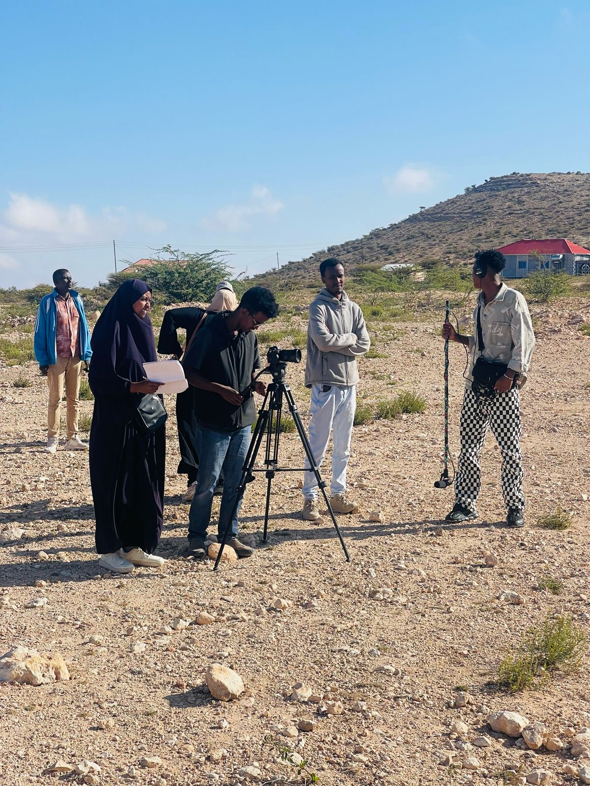A crew filming on location in the Somaliland countryside