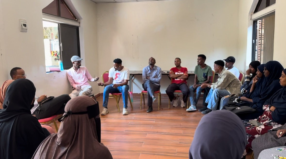 A workshop discussion circle with bootcamp participants